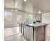 This spacious kitchen features an island with granite countertops and seamlessly connects to the light-filled living space at 529 Dasheill Ln, Atlanta, GA 30349