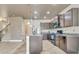 Modern kitchen features updated appliances and an island, seamlessly transitioning into the adjacent living area at 529 Dasheill Ln, Atlanta, GA 30349