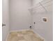 Laundry room with tile flooring and white walls with a wire rack at 529 Dasheill Ln, Atlanta, GA 30349