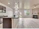 An open-concept living space with a fireplace as a focal point and a modern kitchen featuring granite countertops at 529 Dasheill Ln, Atlanta, GA 30349