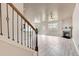 View of a living room featuring stairs, a fireplace, a ceiling fan, and hardwood floors at 529 Dasheill Ln, Atlanta, GA 30349