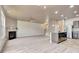 An open concept connects the living area fireplace, kitchen with island, and stairs to the upper level at 529 Dasheill Ln, Atlanta, GA 30349