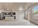 Large open floor plan featuring a modern kitchen with stainless steel appliances and a bright, airy living space at 529 Dasheill Ln, Atlanta, GA 30349