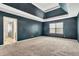 Spacious main bedroom with ensuite bathroom, window and plush neutral carpeting at 529 Dasheill Ln, Atlanta, GA 30349