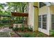 A home's backyard deck features a wooden roof, patio and lush landscaping at 2866 Wynford Sw Dr, Marietta, GA 30064