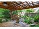 Charming backyard with wooden deck, pergola, and peaceful rock garden with small waterfall at 2866 Wynford Sw Dr, Marietta, GA 30064