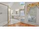 Bright primary bathroom with soaking tub, window and glass shower at 2866 Wynford Sw Dr, Marietta, GA 30064