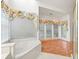 Bright and spacious primary bathroom features soaking tub and lots of windows at 2866 Wynford Sw Dr, Marietta, GA 30064