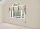 Bedroom features a large arched window and neutral carpet, paint, and blinds at 2866 Wynford Sw Dr, Marietta, GA 30064