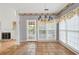 Cozy dining area with tile floor, chandelier, decorative wall paper and access to backyard at 2866 Wynford Sw Dr, Marietta, GA 30064