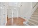 Bright foyer with hardwood floors, staircase, and natural light from the window above the front door at 2866 Wynford Sw Dr, Marietta, GA 30064