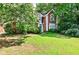 Charming brick home featuring a well-manicured lawn and mature trees in a desirable neighborhood at 2866 Wynford Sw Dr, Marietta, GA 30064