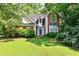 Charming brick home featuring a well-manicured lawn and mature trees in a desirable neighborhood at 2866 Wynford Sw Dr, Marietta, GA 30064