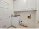 Laundry room with built-in cabinets and storage area at 2866 Wynford Sw Dr, Marietta, GA 30064