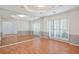 Bright, spacious living room with large windows, mirrors and hardwood floors at 2866 Wynford Sw Dr, Marietta, GA 30064
