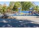 Fenced community playground featuring slides and various play structures for  at 2866 Wynford Sw Dr, Marietta, GA 30064