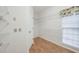 A walk-in closet is clean and organized with white wire shelving and bright window at 2866 Wynford Sw Dr, Marietta, GA 30064