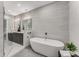 Modern bathroom features a soaking tub, walk-in shower, and large vanity with double sinks at 1099 North Ne Ave # 12, Atlanta, GA 30307