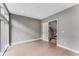 Empty bedroom with hardwood floors and a view to stairs through open doorway at 1099 North Ne Ave # 12, Atlanta, GA 30307