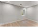 Bright bedroom featuring a small window and beautiful, light hardwood flooring at 1099 North Ne Ave # 12, Atlanta, GA 30307