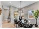 Bright dining room features modern chandelier, glass table, and large windows at 1099 North Ne Ave # 12, Atlanta, GA 30307