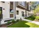 Modern home with manicured front yard, artificial turf, and a walkway leading to the front door at 1099 North Ne Ave # 12, Atlanta, GA 30307