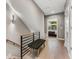 Hallway with wood floors and modern iron and wood railing, with a view into a bedroom at 1099 North Ne Ave # 12, Atlanta, GA 30307
