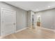 Hallway with hardwood floors and view into a bathroom and staircase through open doorways at 1099 North Ne Ave # 12, Atlanta, GA 30307