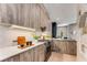 Stylish kitchen with wood cabinets, quartz countertops, and stainless steel appliances at 1099 North Ne Ave # 12, Atlanta, GA 30307