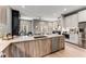 Open kitchen features a large island with quartz countertops, stainless steel appliances, and hardwood floors at 1099 North Ne Ave # 12, Atlanta, GA 30307