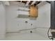 Unfinished basement features built-in shelving, exposed duct work, and utility hookups at 629 Pine Ter, Canton, GA 30114