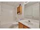 Full bathroom with shower-tub combo features oak vanity cabinet and framed mirror at 629 Pine Ter, Canton, GA 30114