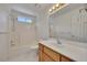 Clean bathroom featuring a shower/tub combination, a sink with cabinet, and a large mirror at 629 Pine Ter, Canton, GA 30114