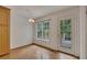Bright breakfast nook area with hardwood floors, access to the rear deck, and natural light at 629 Pine Ter, Canton, GA 30114