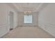 Dining room featuring decorative molding, a chandelier, and large window with natural light at 629 Pine Ter, Canton, GA 30114
