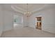 Formal dining room showcasing a view of the open floor plan with decorative molding and chandelier at 629 Pine Ter, Canton, GA 30114
