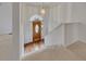 Inviting foyer with hardwood floors, staircase, and natural light streaming through the front door at 629 Pine Ter, Canton, GA 30114