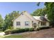 Charming traditional-style home with an arched entryway and manicured landscaping at 629 Pine Ter, Canton, GA 30114