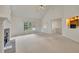 Spacious living room with fireplace, large window, neutral carpeting, and vaulted ceiling at 629 Pine Ter, Canton, GA 30114
