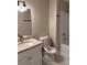 Bathroom with granite counters, a modern faucet, and a shower-tub combination at 425 Orchard Dr, Stone Mountain, GA 30083