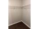 Walk-in closet featuring wire shelving for plenty of storage and durable wood-look floors at 425 Orchard Dr, Stone Mountain, GA 30083