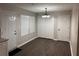 Open Dining Room, white doors and cabinets, complete with wooden flooring and a ceiling fan at 425 Orchard Dr, Stone Mountain, GA 30083