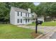 Charming two-story home featuring a classic design, well-maintained lawn, and inviting front porch at 425 Orchard Dr, Stone Mountain, GA 30083