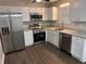 Well-designed kitchen features granite counters, stainless appliances, and plenty of storage space at 425 Orchard Dr, Stone Mountain, GA 30083