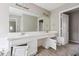 Spacious bathroom features a double vanity and large mirror at 4467 Boatmans Cv, Stone Mountain, GA 30083