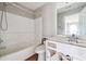 Bathroom featuring a bathtub and single sink vanity at 4467 Boatmans Cv, Stone Mountain, GA 30083