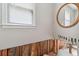 Partially renovated bathroom with a round mirror on the wall at 4467 Boatmans Cv, Stone Mountain, GA 30083