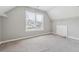 This bedroom offers natural light through a window and closet space at 4467 Boatmans Cv, Stone Mountain, GA 30083