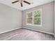 Bright bedroom with a ceiling fan, and windows bringing in natural light at 4467 Boatmans Cv, Stone Mountain, GA 30083