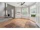A spacious breakfast nook with a ceiling fan and multiple windows at 4467 Boatmans Cv, Stone Mountain, GA 30083